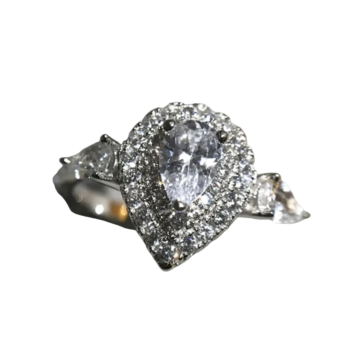A pink teardrop zircon engagement ring featuring a sparkling pear-shaped center stone with a diamond halo and accent band