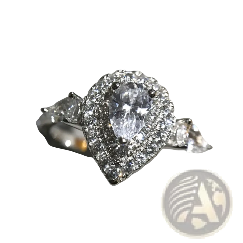 Pink teardrop zircon engagement ring featuring a sparkling pear-shaped diamond halo with accent stones on the band
