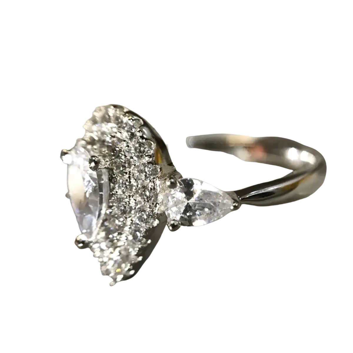 A sparkling silver pink teardrop zircon engagement ring with pear-shaped diamond and triangular side stones haloed
