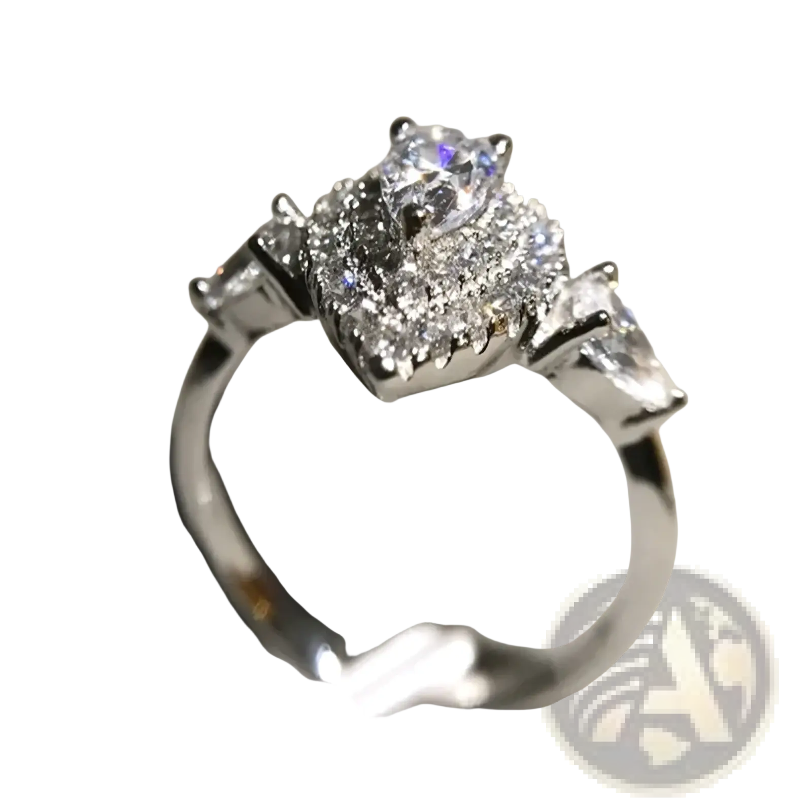 A pink teardrop zircon engagement ring with a sparkling silver band and pear-shaped diamond surrounded by round and baguette diamonds