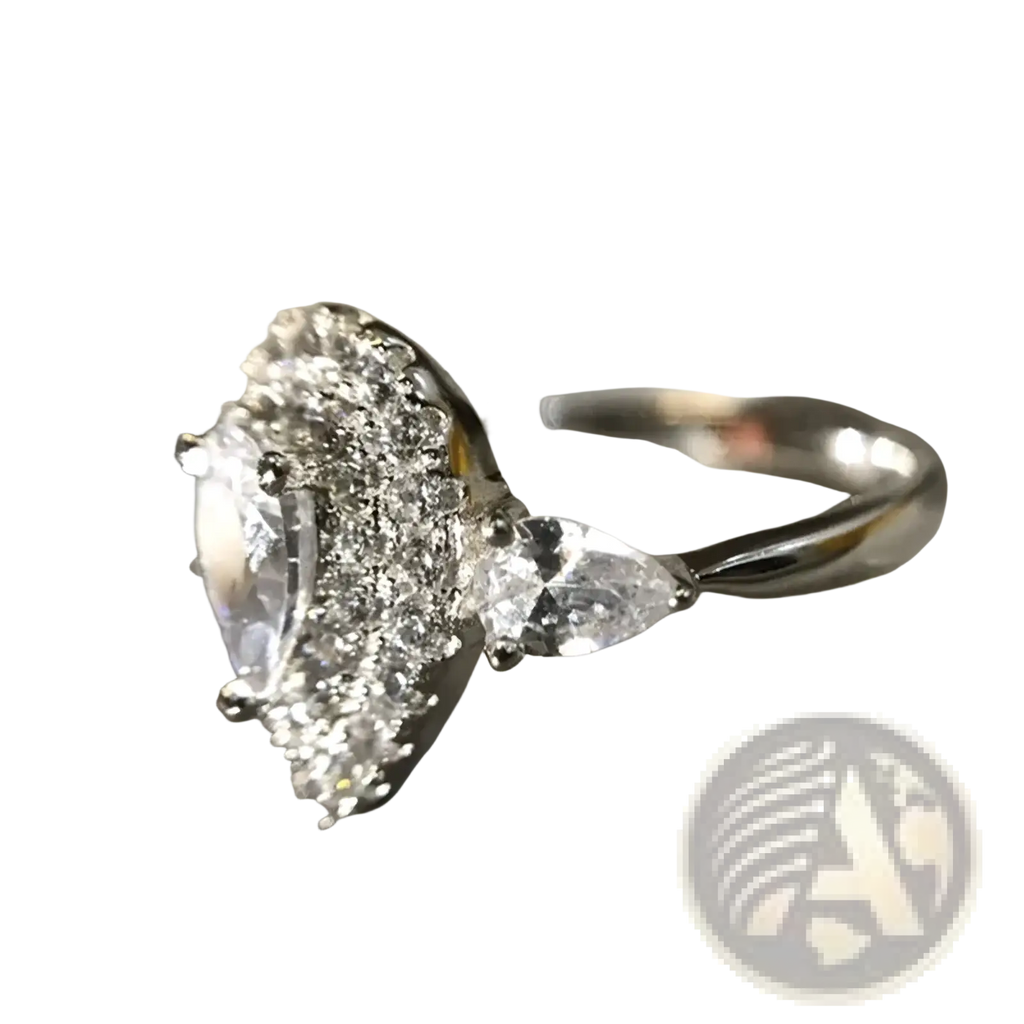 A sparkling silver pink teardrop zircon engagement ring with pear-shaped diamond and triangular side stones haloed