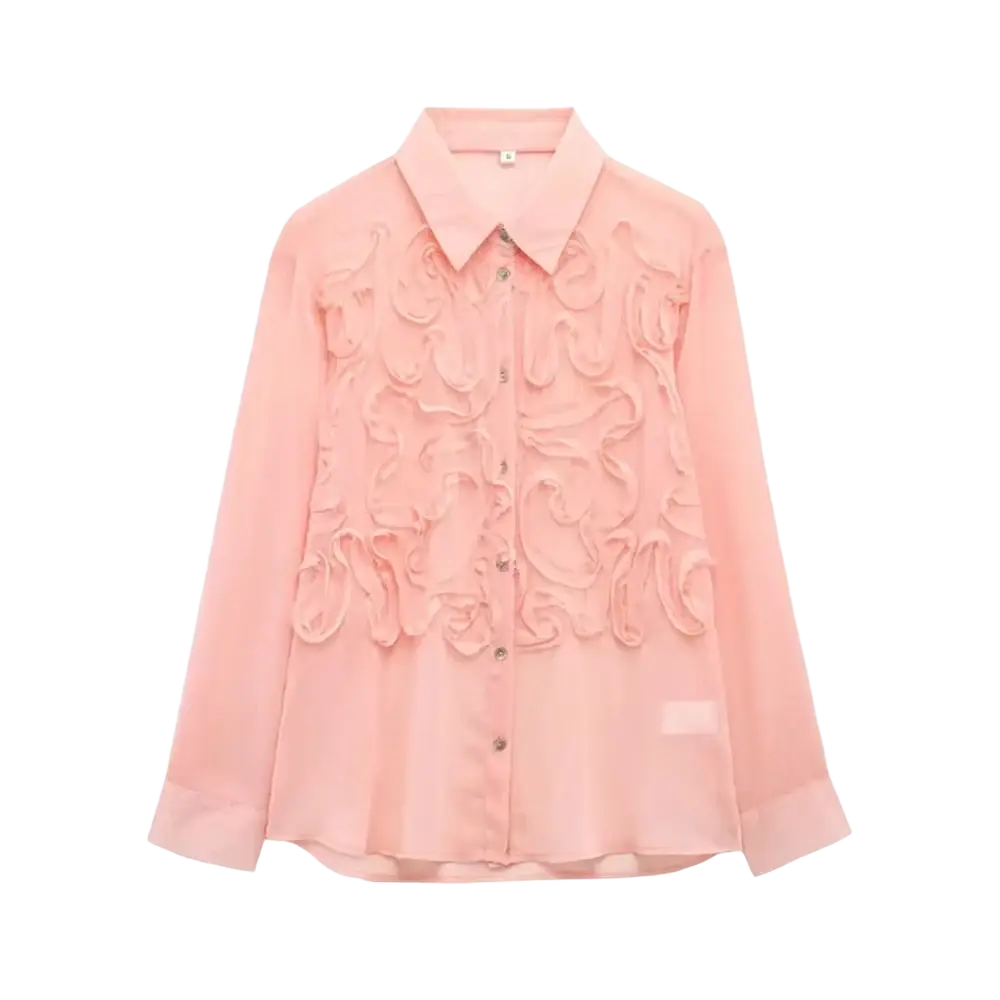 A delicate pink textured ruffled button up blouse with intricate floral embroidery on lightweight sheer fabric