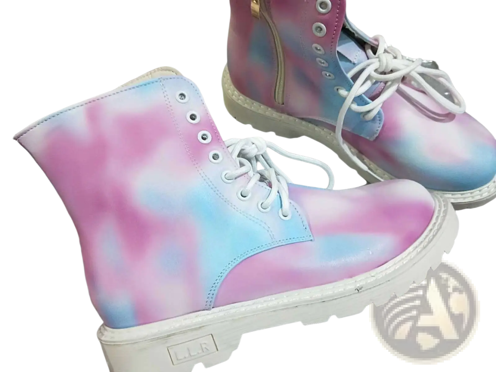 Pink tie dye combat boots with chunky white sole white laces close up view of front side
