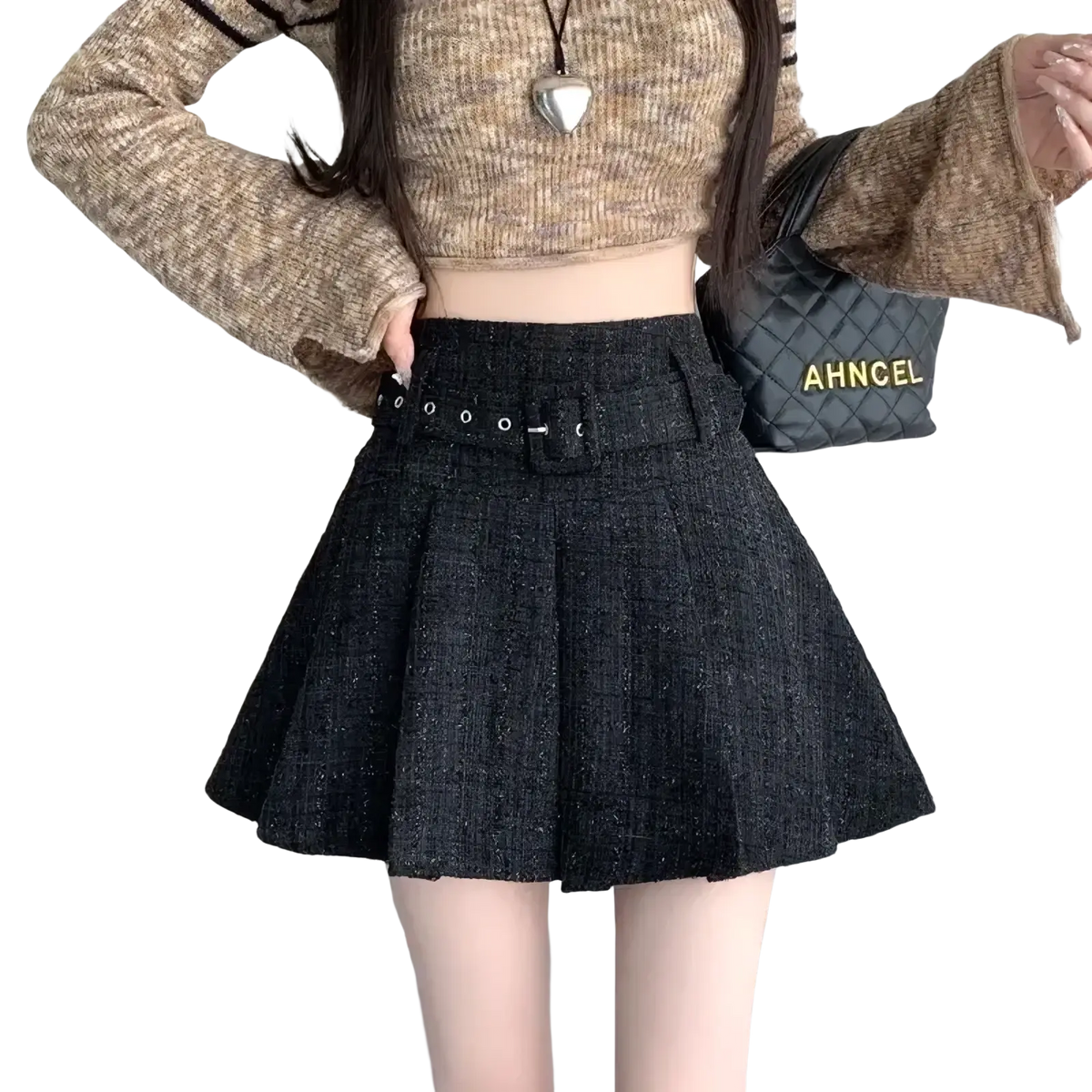 Black pleated mini skirt in textured tweed fabric with matching belt and silver-toned hardware detail