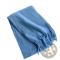 Pink winter cashmere scarf for women featuring a soft light blue knit with fringed edges neatly folded on a white table