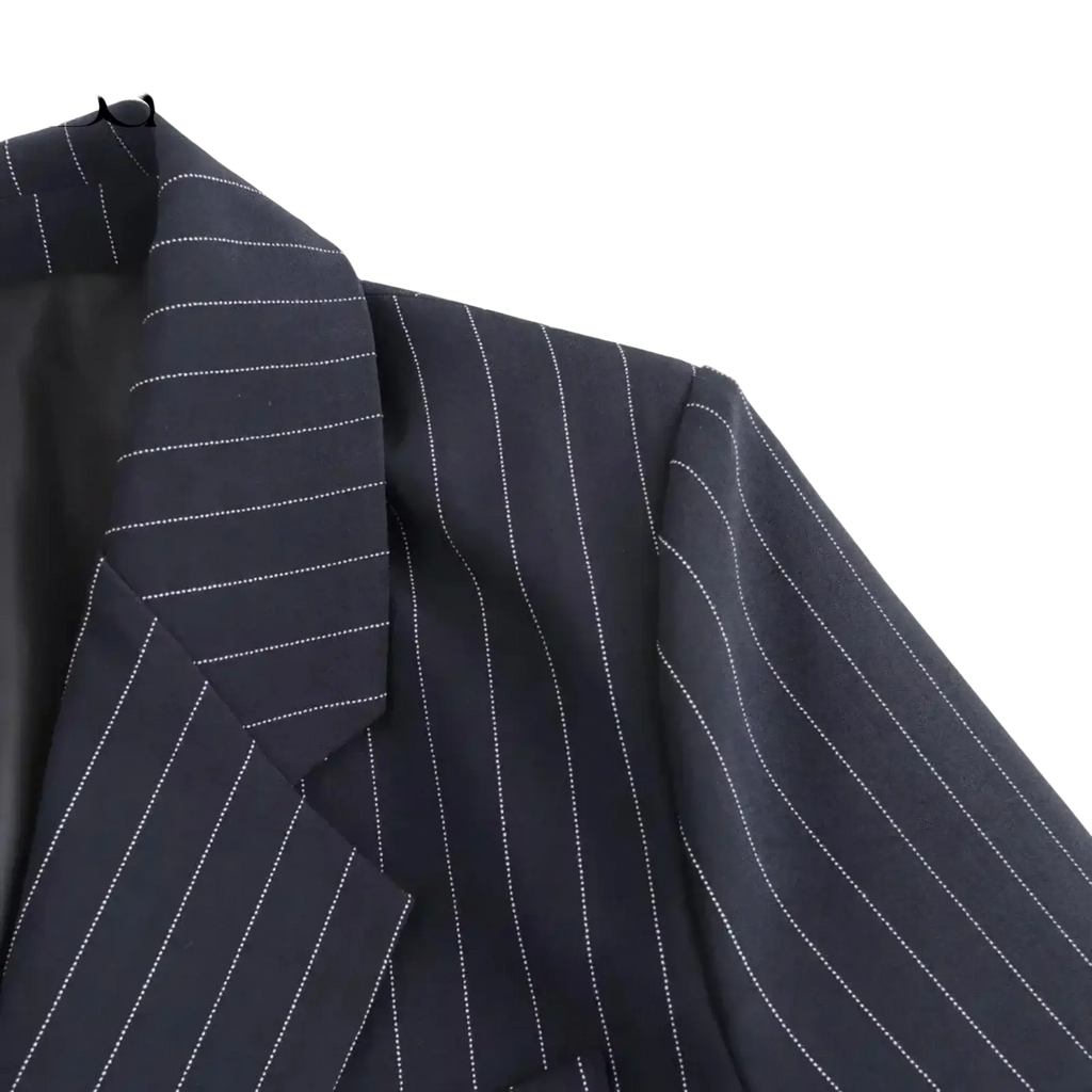 Dark navy pinstripe double-breasted blazer for women with fine white dotted lines and tailored fit