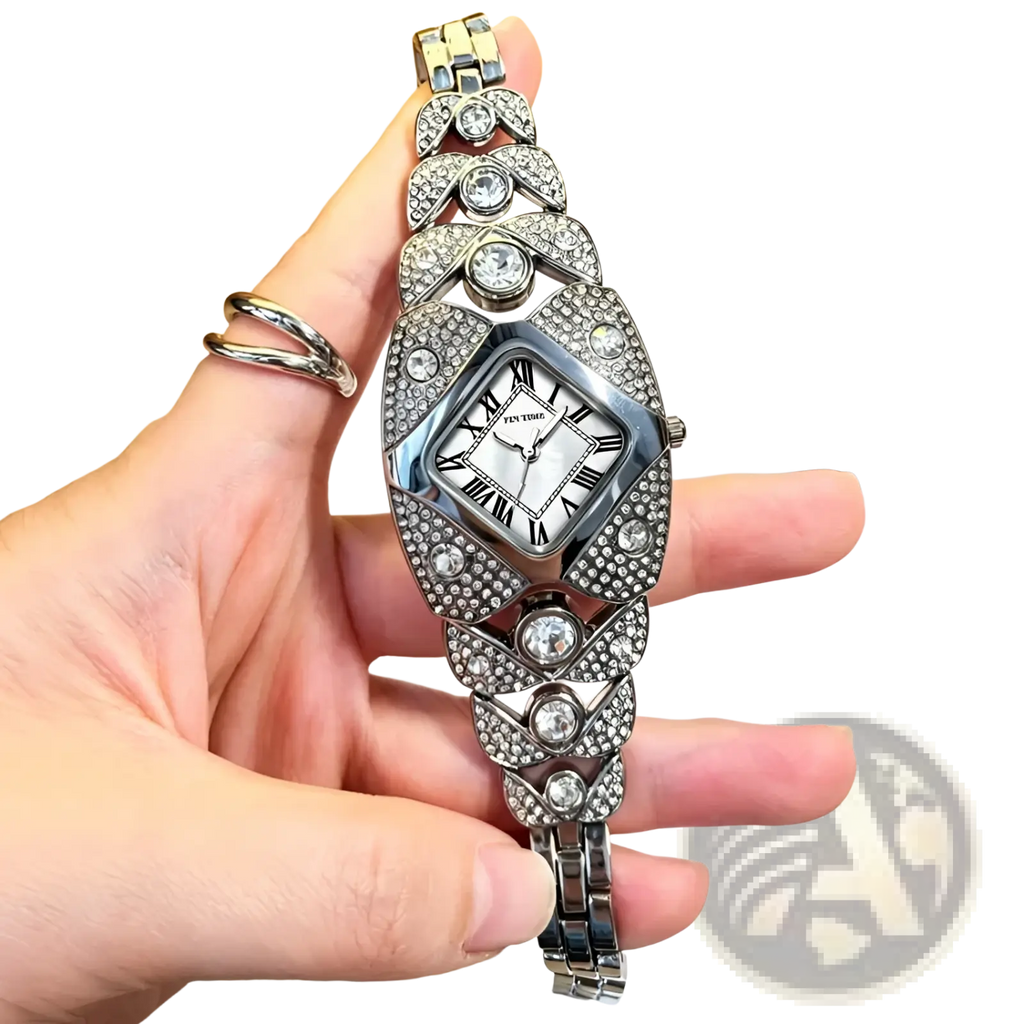 A sparkling silver Pintime diamond quartz watch for ladies featuring a diamond-encrusted rectangular face and crystal bracelet