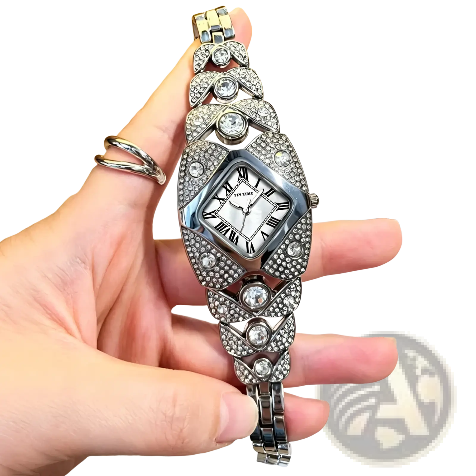 A sparkling silver Pintime diamond quartz watch for ladies featuring a diamond-encrusted rectangular face and crystal bracelet