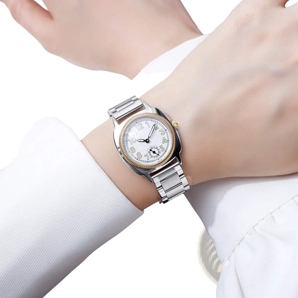 A sleek silver and gold-tone stainless steel pintime quartz watch for women with a white dial and black arabic numerals