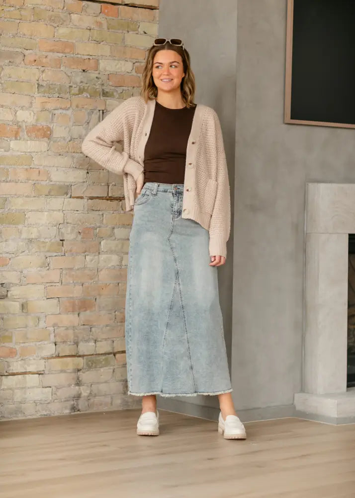 Piper light wash a-line denim maxi skirt in light-wash denim with frayed hem and side seam detailing