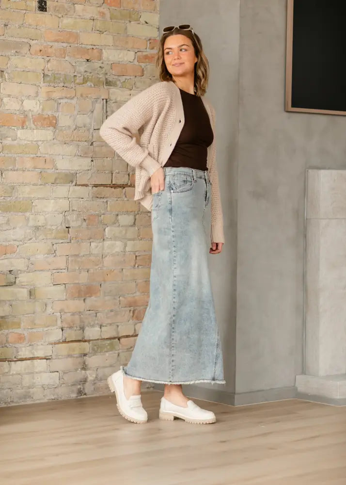 Piper light wash a-line denim maxi skirt with frayed hem and classic stitching in light-wash denim material