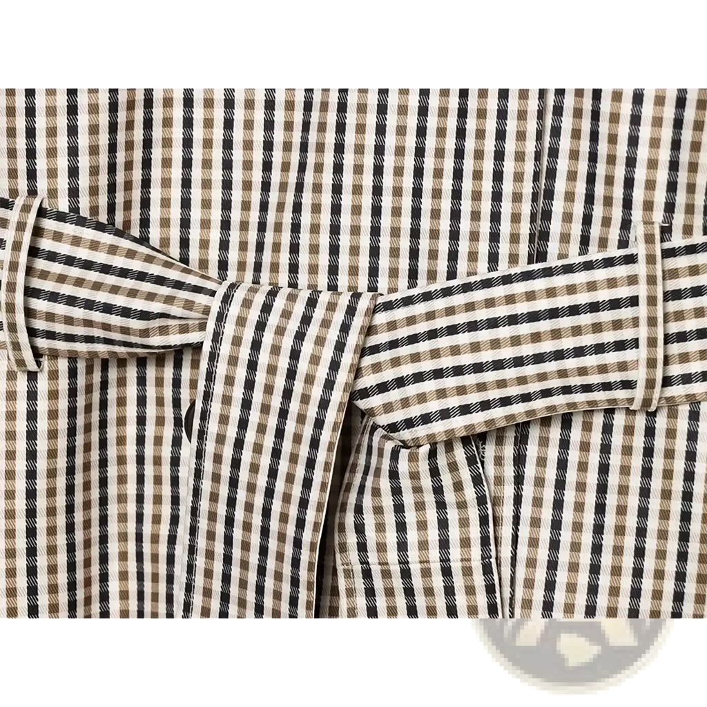 A plaid belted short trench jacket featuring a beige and black striped fabric belt with a subtle checkered pattern
