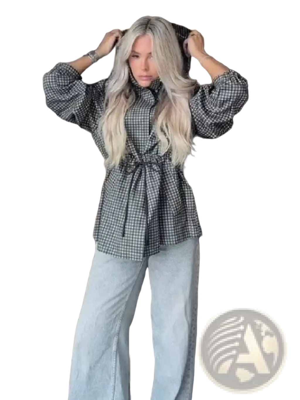 A woman wearing a black and white checkered blouse with puffed sleeves under a plaid hooded trench jacket for fall