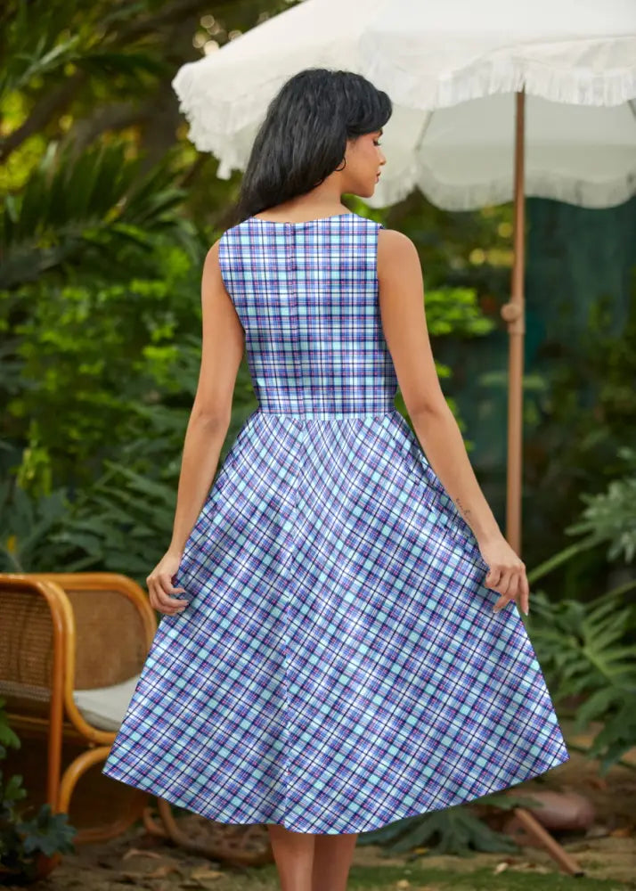 Blue and cream plaid 1950s cotton midi swing dress with sleeveless fitted bodice and a-line flared skirt