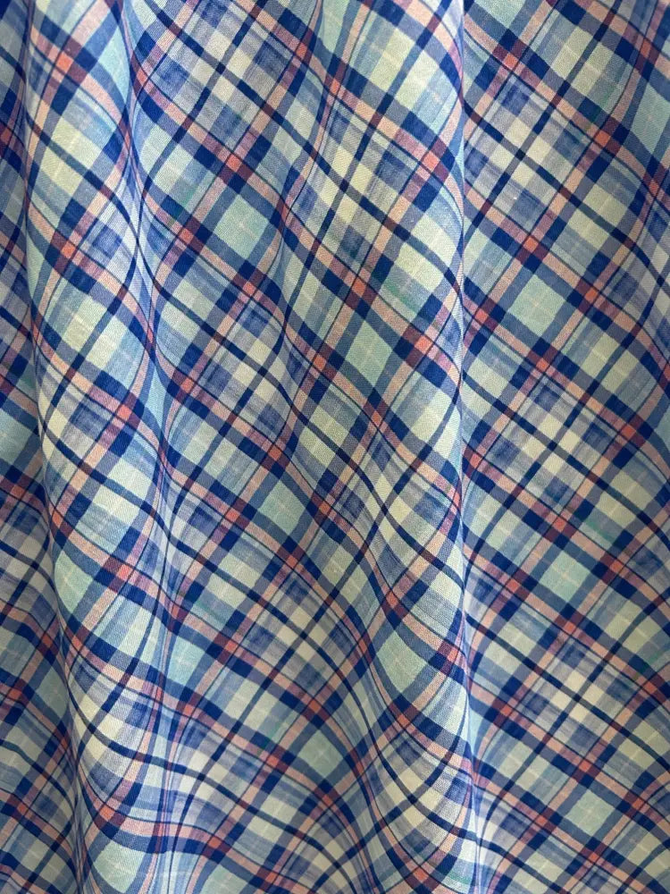 Blue and cream plaid 1950s cotton midi swing dress fabric with woven texture in blue red and cream colors