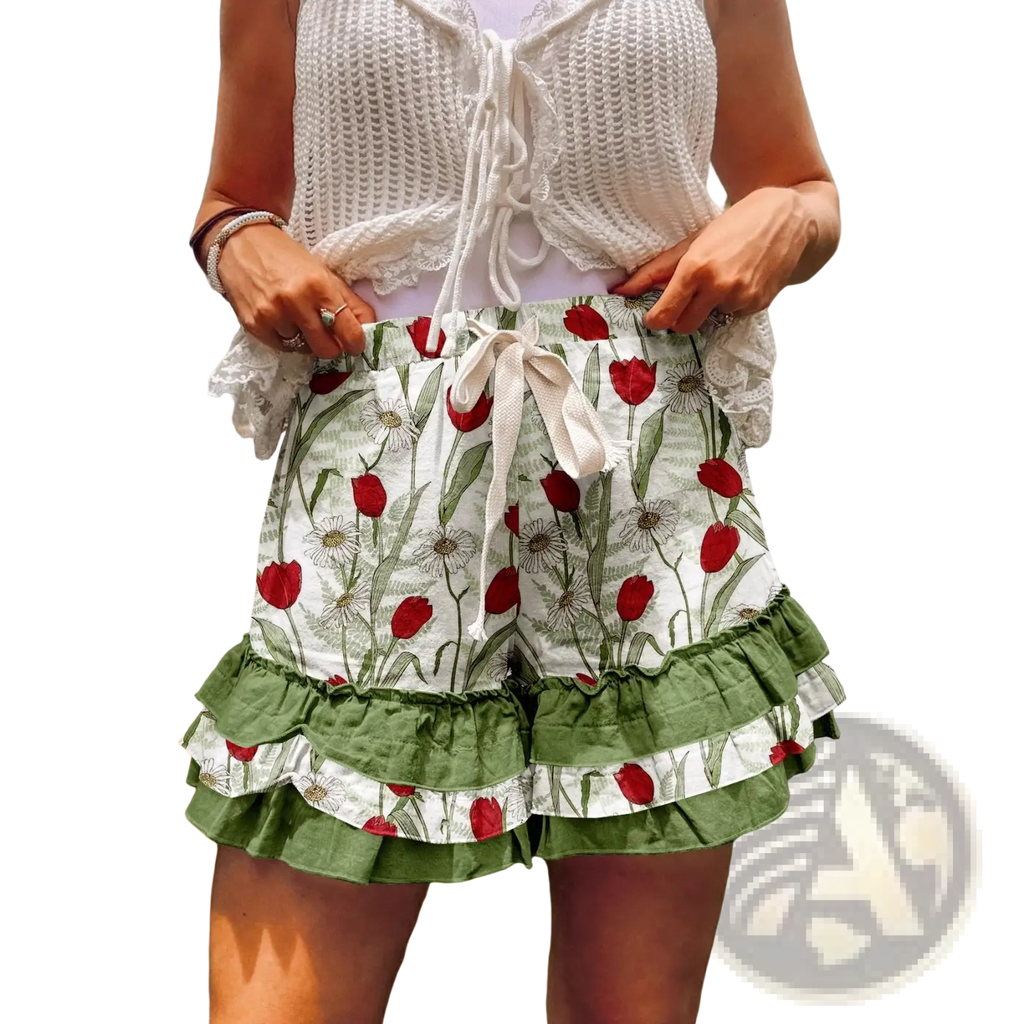 White and green floral print shorts with ruffled hem paired with plaid patchwork a-line skirt design