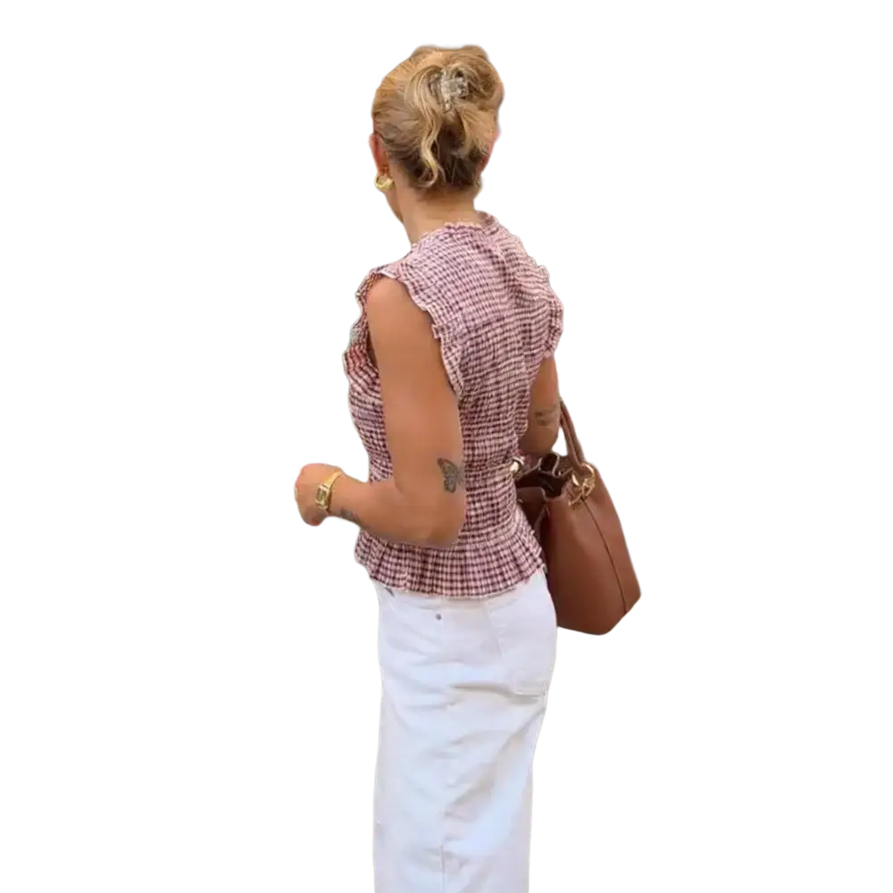 Brown leather shoulder bag with gold-tone hardware paired with a plaid ruffled sleeveless summer tank top