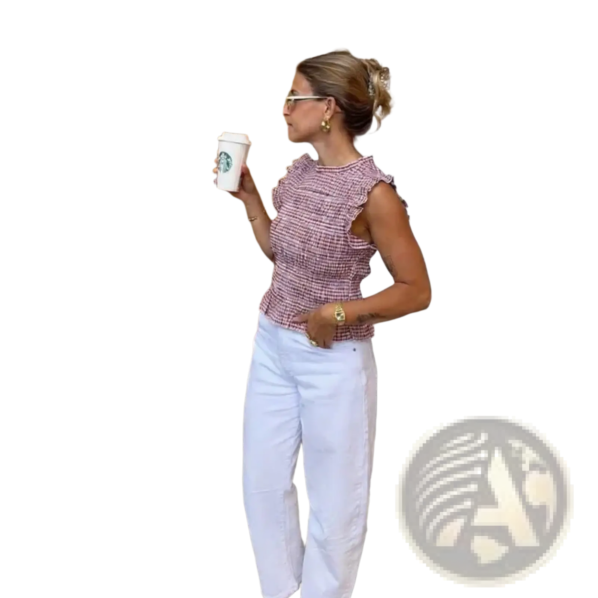 A woman wearing a pink and white houndstooth textured plaid ruffled sleeveless summer tank top