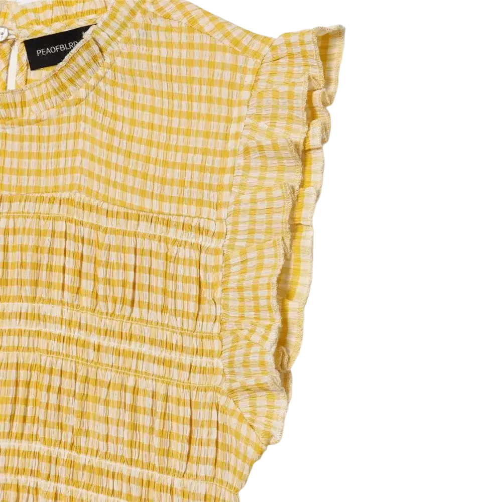 Yellow and white gingham check sleeveless summer tank top with ruffled sleeves for a stylish warm weather look