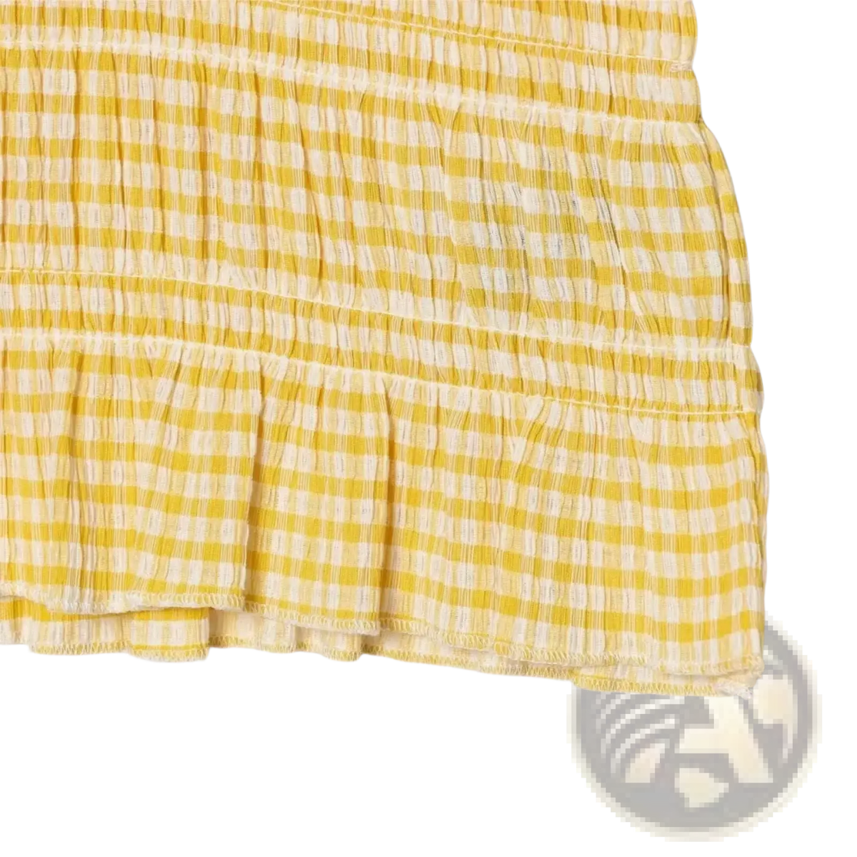 A yellow and white gingham skirt with a ruffled hem paired with a sleeveless plaid ruffled summer tank top