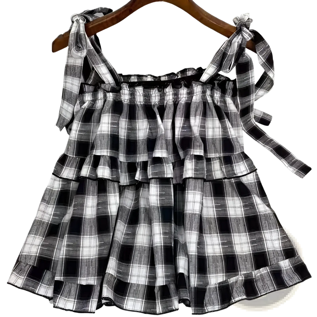 Black and white plaid tiered dress with ruffles and tied shoulder bow straps perfect for casual wear