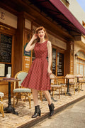 A red and white checkered sleeveless 1950s cotton a-line dress with fitted bodice flared skirt and pockets