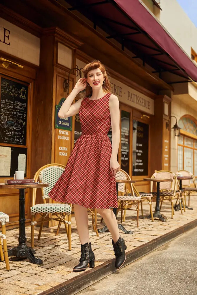 A red and white checkered sleeveless 1950s cotton a-line dress with fitted bodice flared skirt and pockets