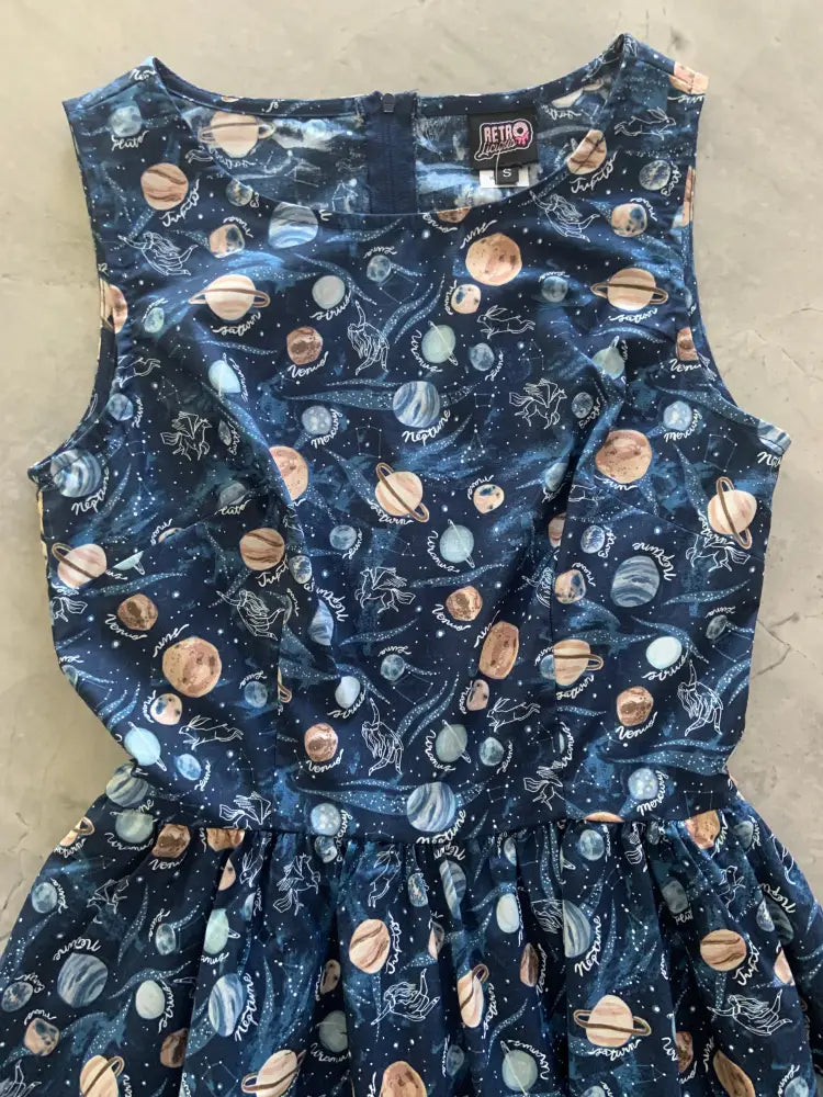 Vintage 1950s navy sleeveless cotton dress with celestial print of planets moons and stars and pockets