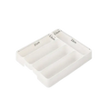White plastic cutlery drawer organizer with four varying compartments for kitchen tray storage