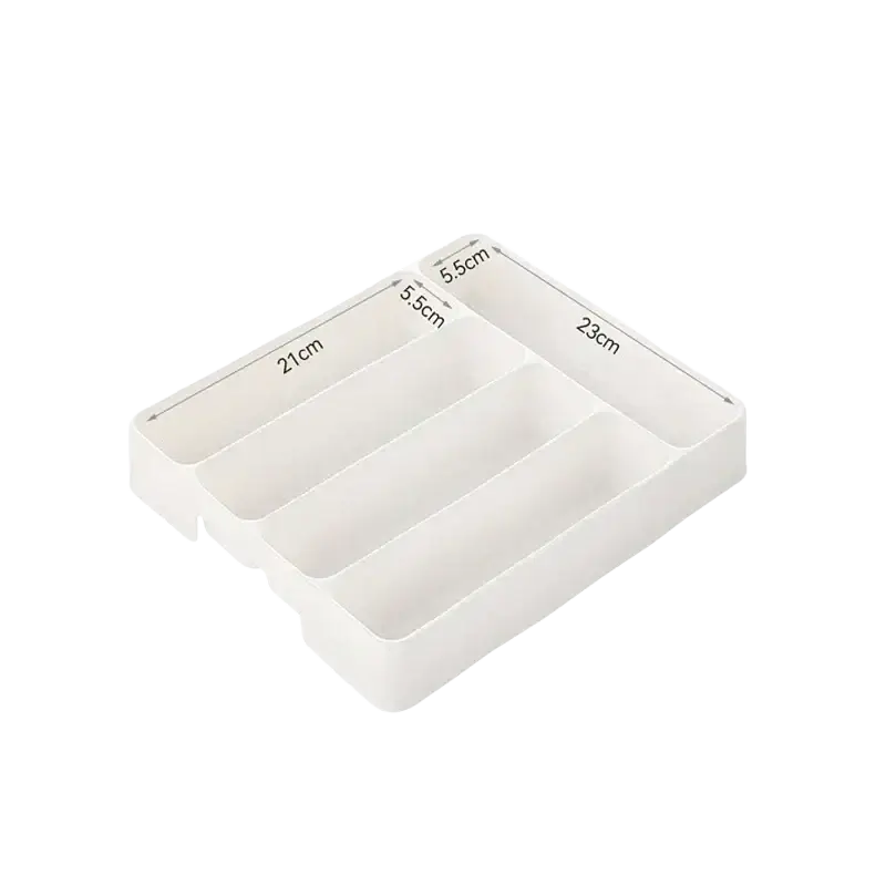 White plastic cutlery drawer organizer with four varying compartments for kitchen tray storage