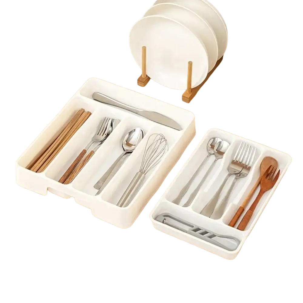 White plastic cutlery drawer organizer with segmented compartments for kitchen utensils and cutlery storage tray