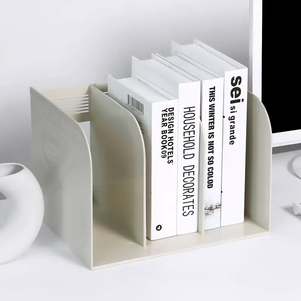 Minimalist off-white plastic desk organizer and bookshelf storage rack holding neatly arranged white books