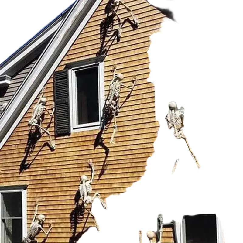 White plastic skeleton decorations mounted on a house exterior for halloween display use