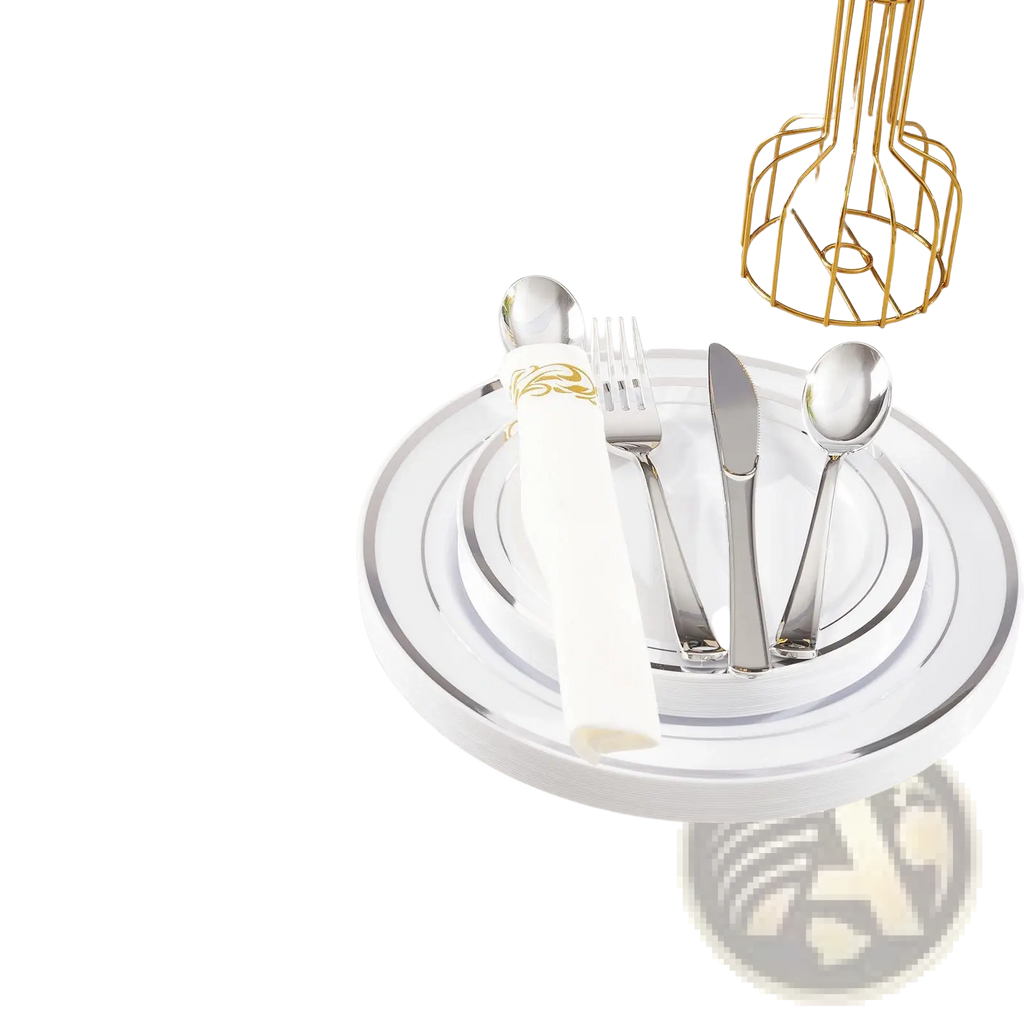 Set of silver-toned stainless steel cutlery arranged on white plastic tableware plates with gold rim for 50 guests