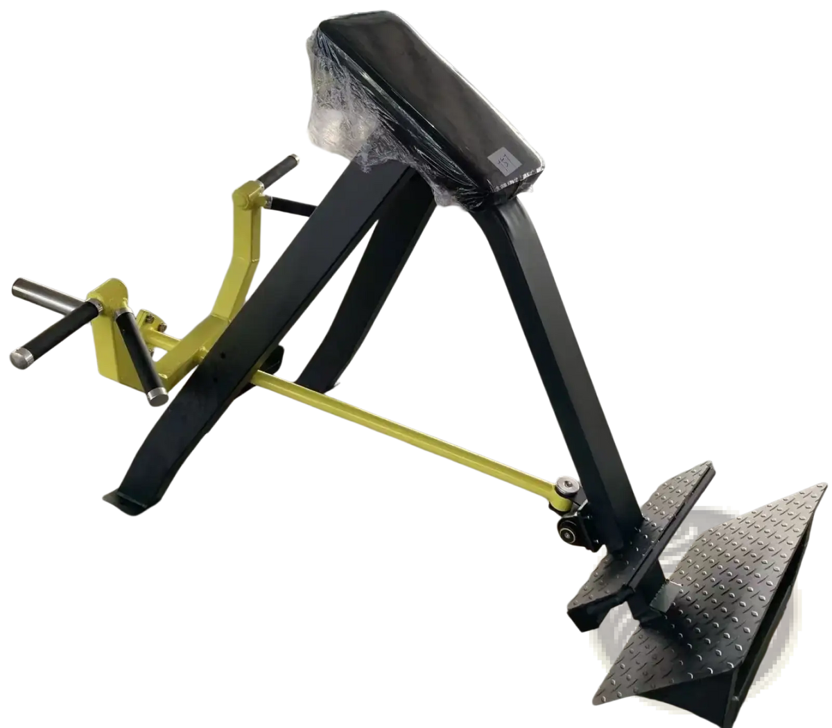 Plate loaded seated row machine in yellow and black with padded seat, metal frame, and textured footplate shown from back side