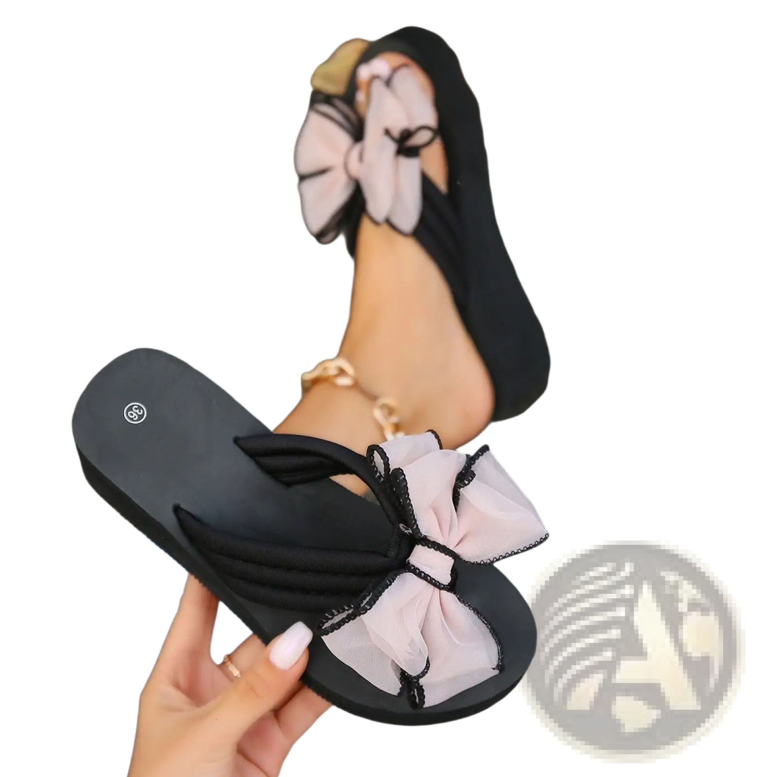 Black platform flip-flops with a large light pink sheer bow accent trimmed in black for stylish wear