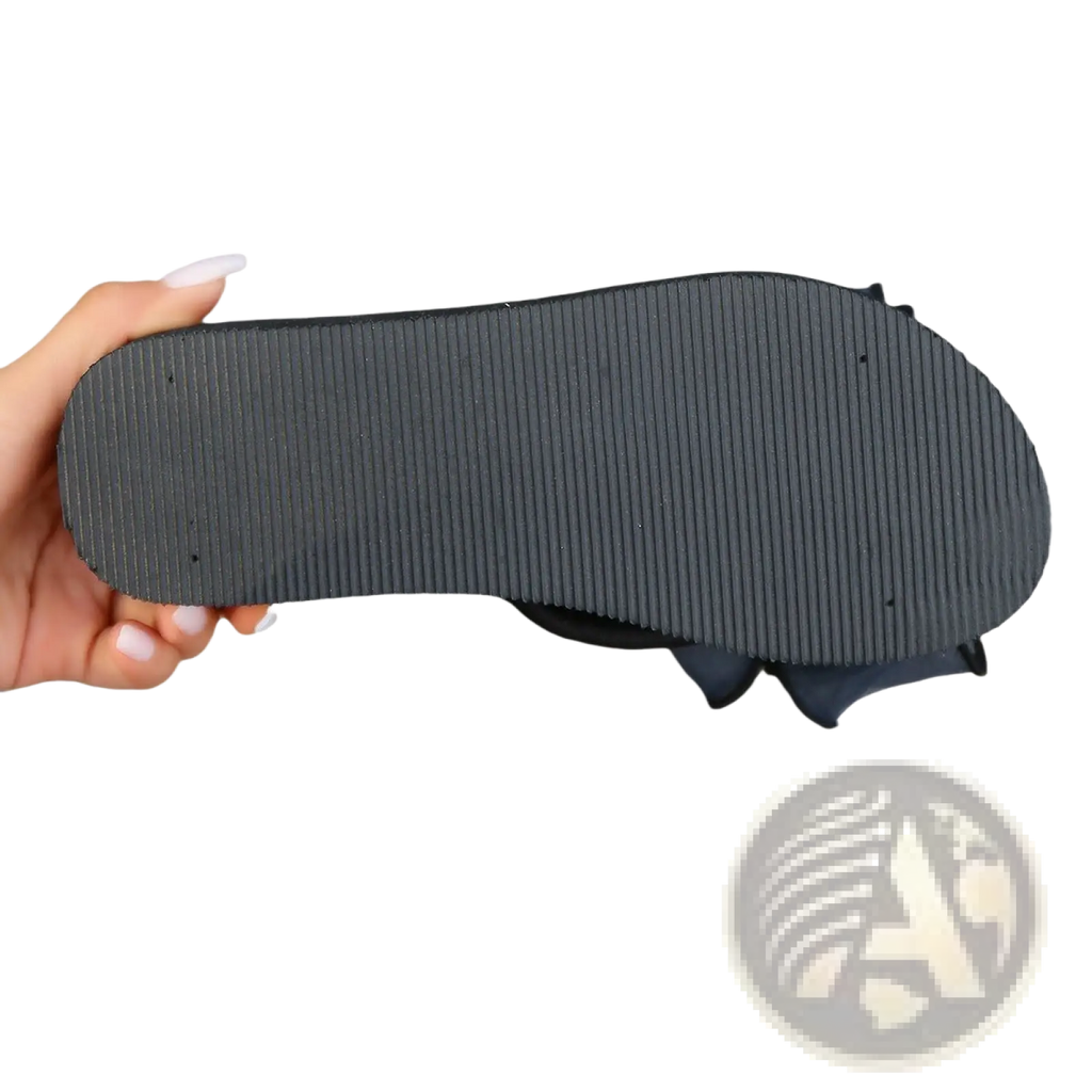 Platform flip flops with black rubber ribbed sole and dark blue sheer bow accent on the upper part