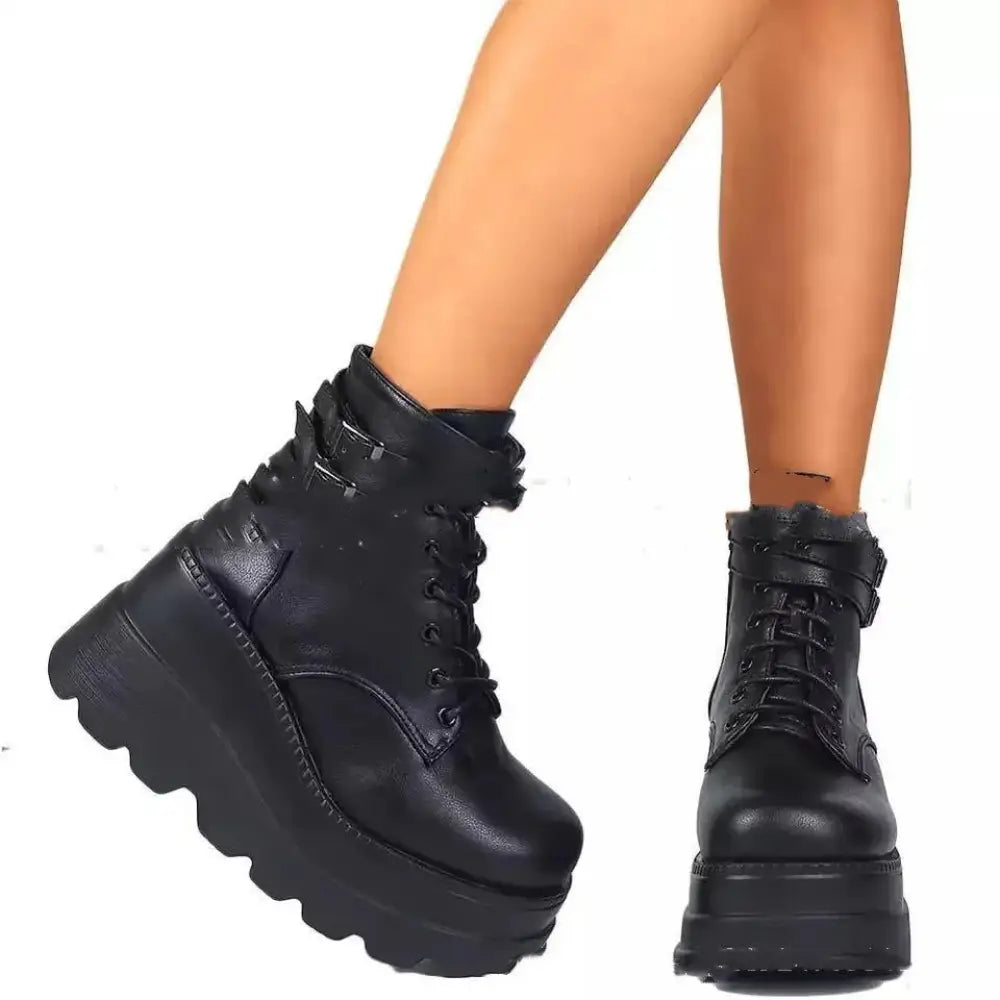 Women’s lace up leather thigh high platform boots in black featuring thick soles and a lace-up design