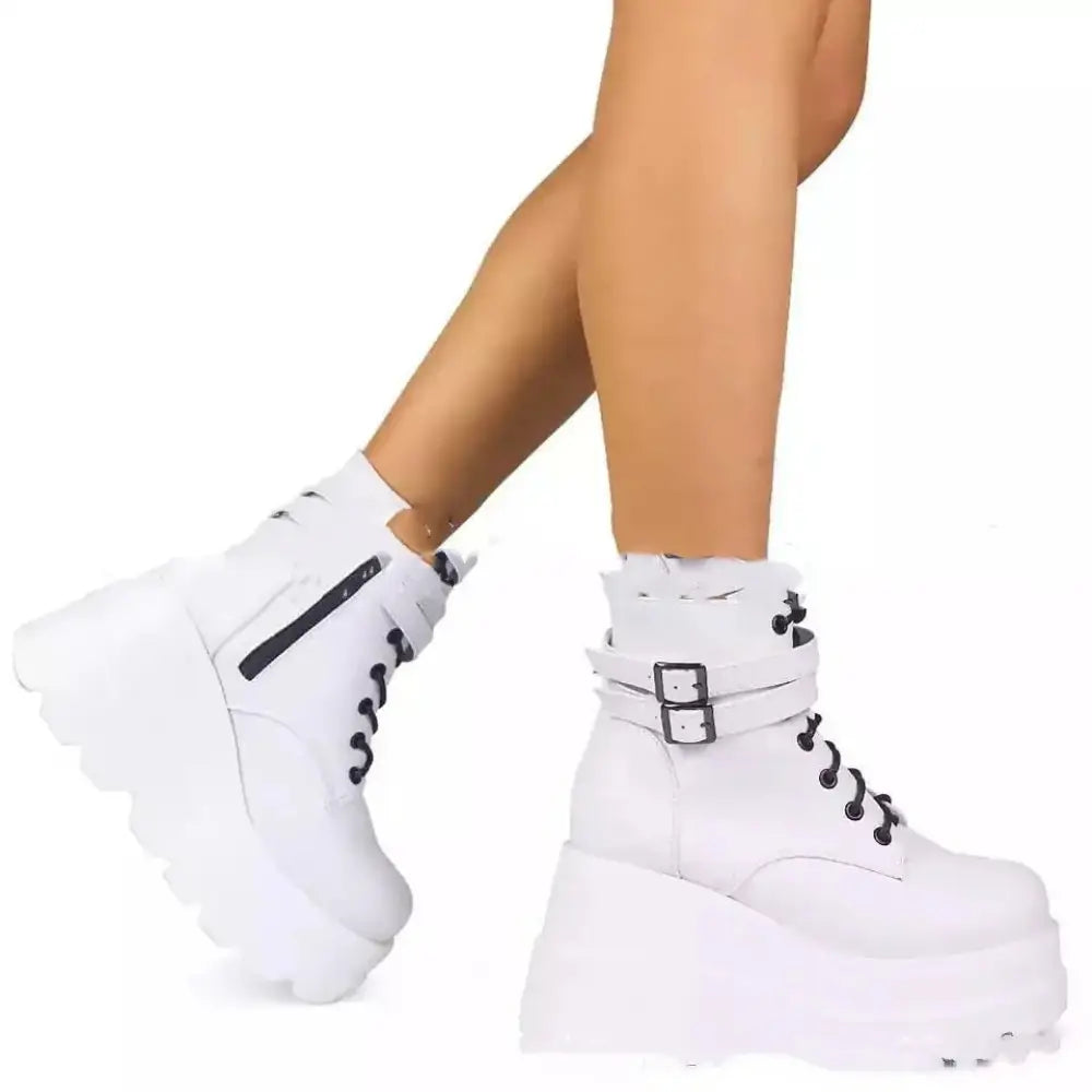 Women’s lace up leather thigh high platform boots in white with black laces and silver buckle detail
