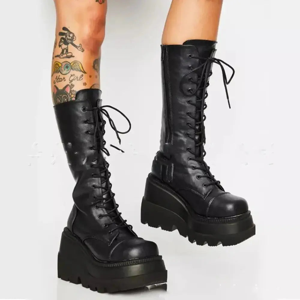 Black leather women’s lace up thigh high platform boots with thick soles and laces shown from the back side