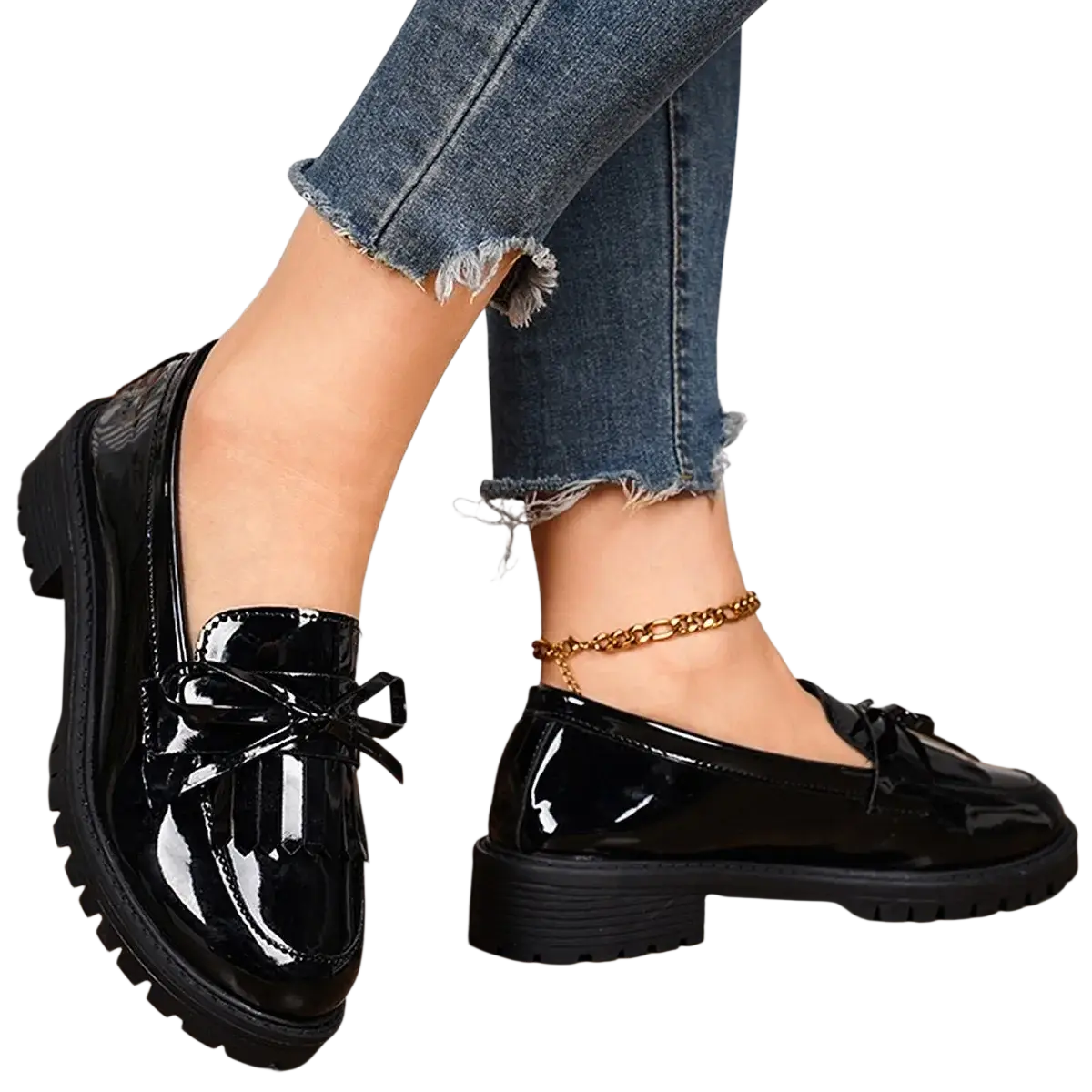 Black patent leather platform tassel loafers for women with glossy finish and decorative bow detail for casual wear