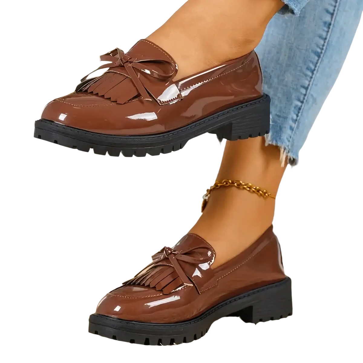 Brown patent leather platform tassel loafers for women with glossy finish and chunky black rubber soles
