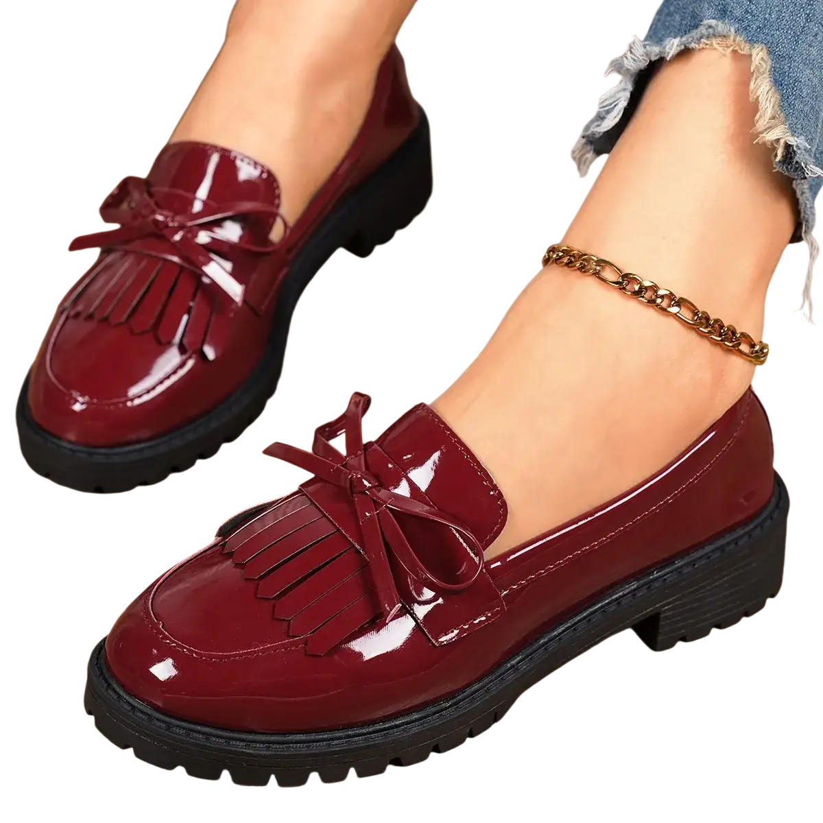Platform tassel loafers for women in burgundy patent leather with fringed bow and chunky black soles for casual wear