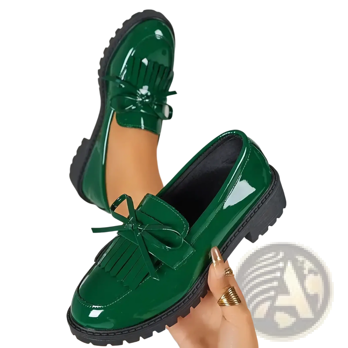 Platform tassel loafers in shiny emerald green patent leather with black rubber soles and decorative bows for casual wear
