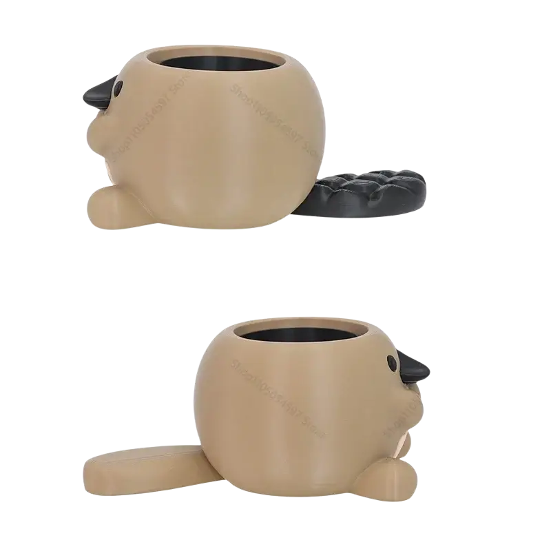 Beige ceramic platypus succulent planter with black plastic tail and nose for desk use