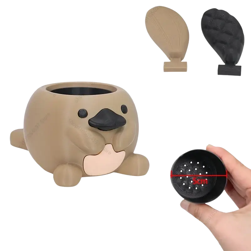 Cute beige plastic platypus succulent planter with black beak pink belly and two interchangeable tail options