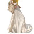 A flowing white pleated chiffon maxi skirt for women made of soft lightweight fabric that drapes elegantly