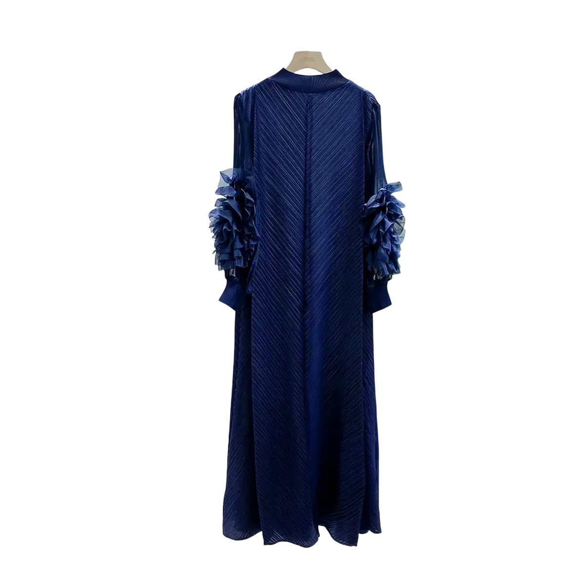 A navy blue pleated evening dress with long sleeves and ruffled floral embellishments for party wear