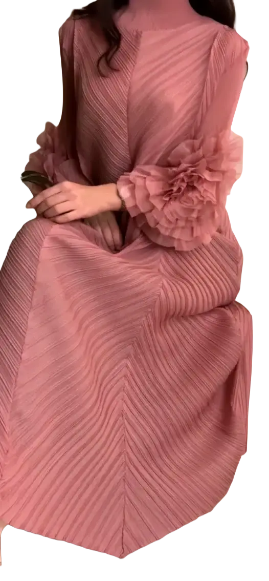 A flowing pink pleated maxi evening dress with voluminous ruffled long sleeves for party occasions