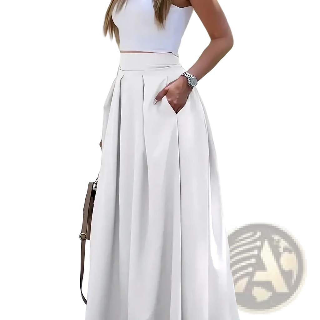 White high-waisted pleated maxi skirt made of lightweight fabric ideal for elegant summer wear